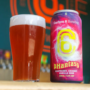 pHantasy Raspberry Vanilla Coconut Sour beer can next to a glass of sour beer, representing a taste of spring.
