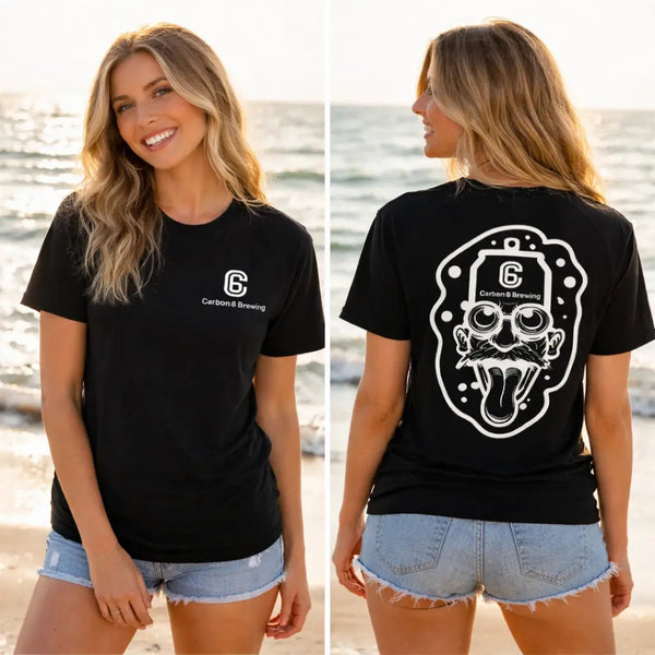 Model wearing Carbon 6 Can Head Brewer Tee in black standing on the beach showing front and back designs.