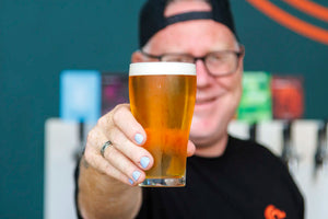 carbon 6 brewing beer in hand at the taproom