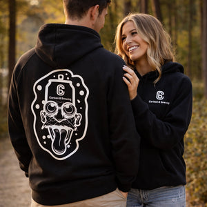 Couple wearing Carbon 6 Can Head Brewer Fleece Hoodie, showcasing unique design in outdoor setting.