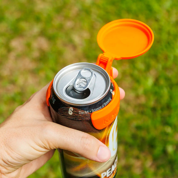 C6 Klever Cap beer can flip lid in use, showcasing a hand holding a can with a bright orange cap.